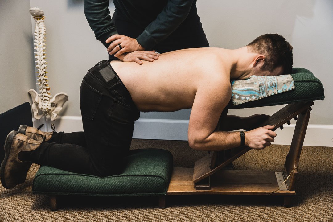 https://images.squarespace-cdn.com/content/v1/641dd02bf41bf102aece788b/230d07e8-45fc-4ecd-8d0f-9a267e3d134f/Leto%2BChiropractic%2BKnee-Chest%2BAdjustment.jpg